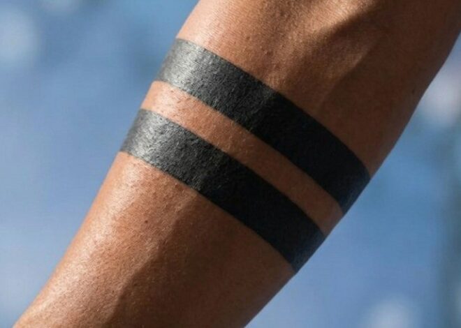People Keep Asking About the Meaning Behind Black Band Tattoos — But What Looks Like a Simple Minimalist Design Often Hides Deeply Personal Stories of Grief, Strength, Transformation, and Identity, While Viral Online Rumors About Secret Symbolism Continue Spreading Across the Internet, Leaving Many Surprised by the Emotional Truth Behind the Popular Tattoo Trend
