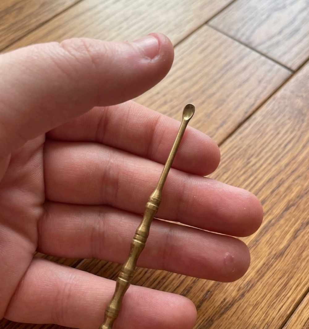 I found this tiny brass SPOON in my mother’s old drawer, but i have no idea what it is. does anyone know?