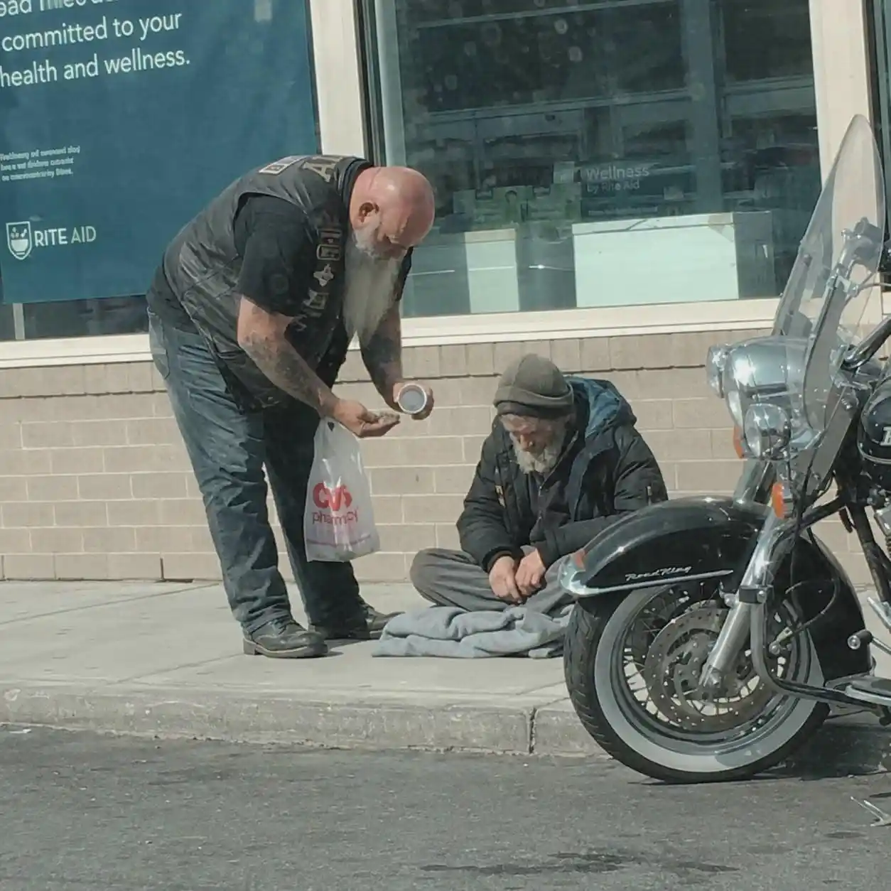 I Filmed A Biker Taking Cash From A Homeless Man Then He Walked Inside