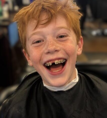 My 9-Year-Old Son’s Barber Whispered, ‘Check Behind His Ear’ – 20 Minutes Later, Two Police Cars Were Outside My House