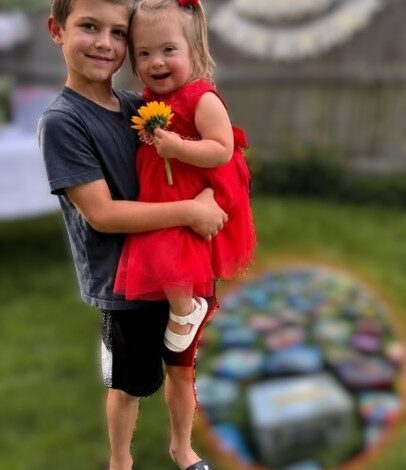 My 8-Year-Old Son Gave Up His Lunch Money to Buy a Little Girl with Down Syndrome a Red Birthday Dress – The Next Morning, Our Lawn Was Covered with Lunchboxes, but What Was Inside the Biggest One Made Him Go Pale