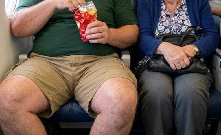 A man spread his legs into my airplane seat for hours refusing to give me any space But when he came back from the restroom he stared at his seat and screamed What the hell did you do